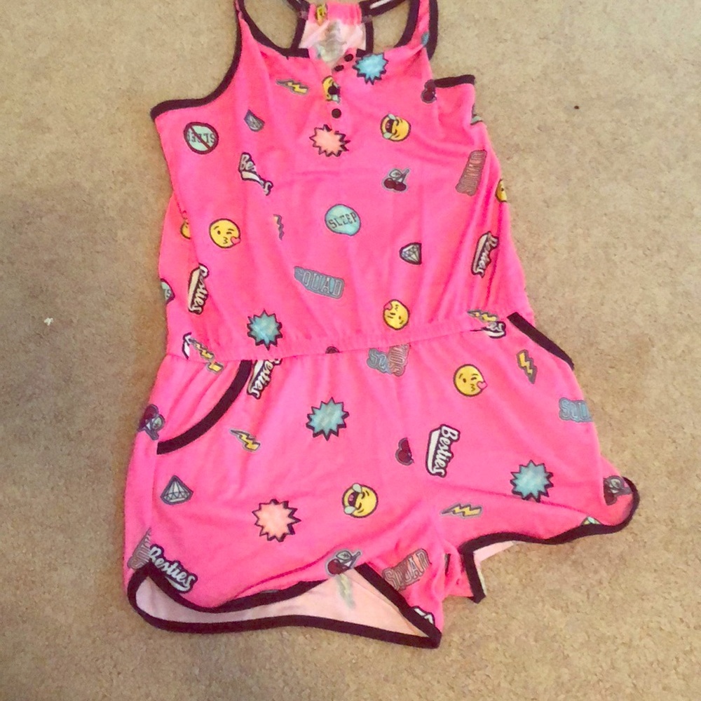 A pink sleep romper with pockets